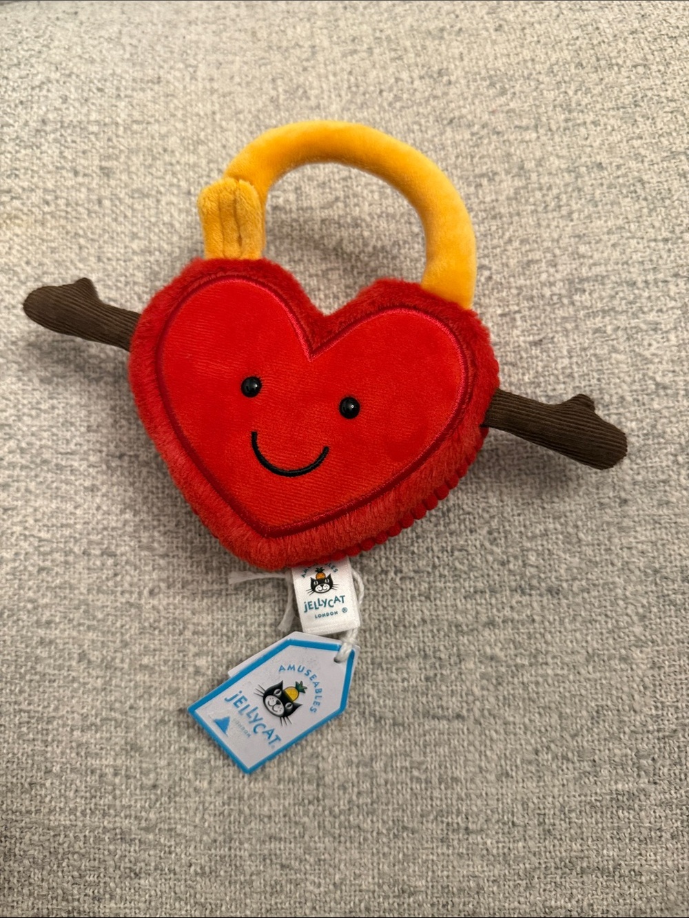 Jellycat Red Heart Plush Lock with Yellow Handle and Brown Twig Arms